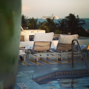 Sipping a mojito by the pool watching a cruise ship sail into the Atlantic!