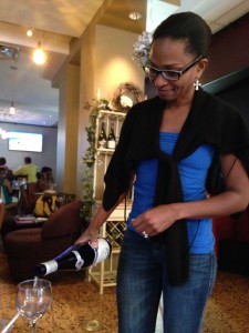 Owner of TheWine Cellars- Renee Rowe pours wine during the tasting.