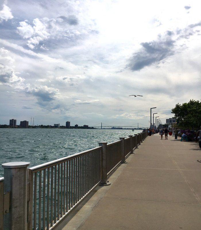 The Detroit Riverwalk with the Ambassador Bridge And Windsor skyline in the background 