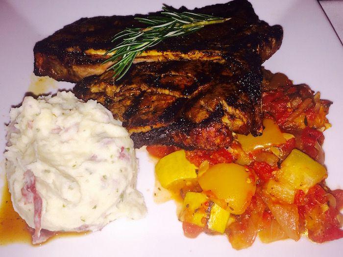 Porterhouse steak with mashed potatoes and vegetables