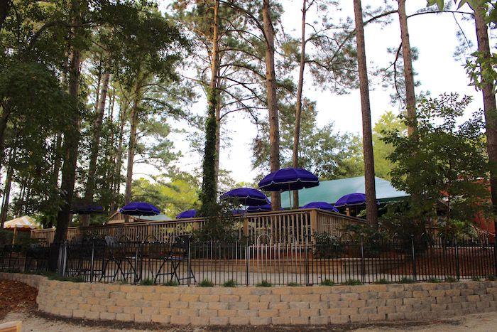 A large deck with tables for entertaining