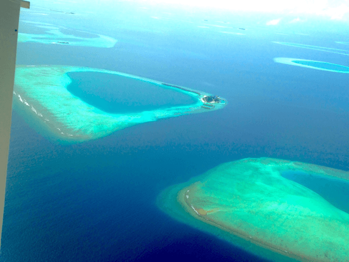 clear blue and green water of The Maldives