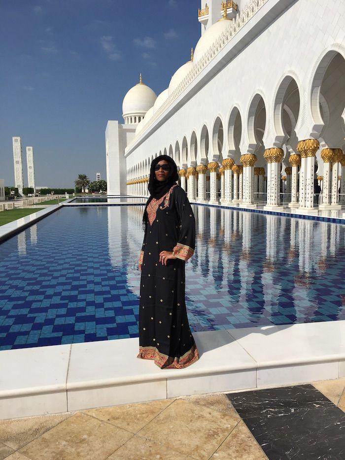 woman in traditional wear at The Grand Mosque