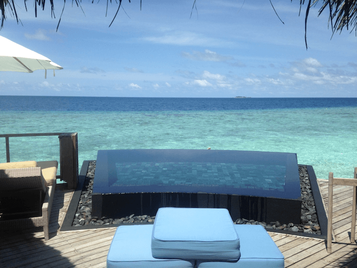 fireplace on the deck of a water villa