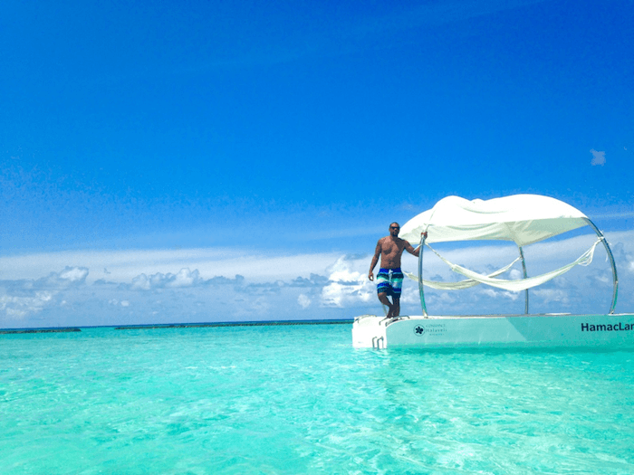 man at edge of platform overlooking ocean