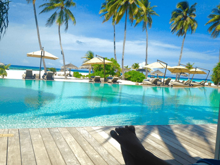 ocean and beach with lounge chairs