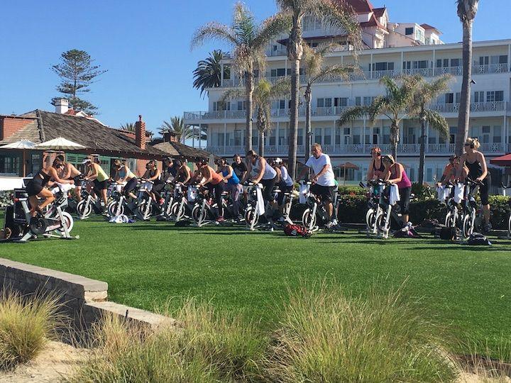 people on spin bikes outside in front of Hotel Del Coronado