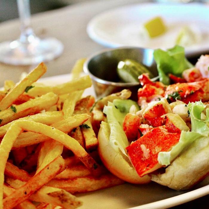 A Lobster Roll with French fries