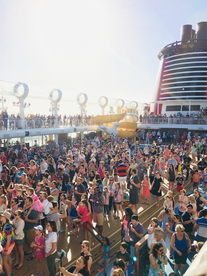 crowd at a sail away party on a Disney cruise ship