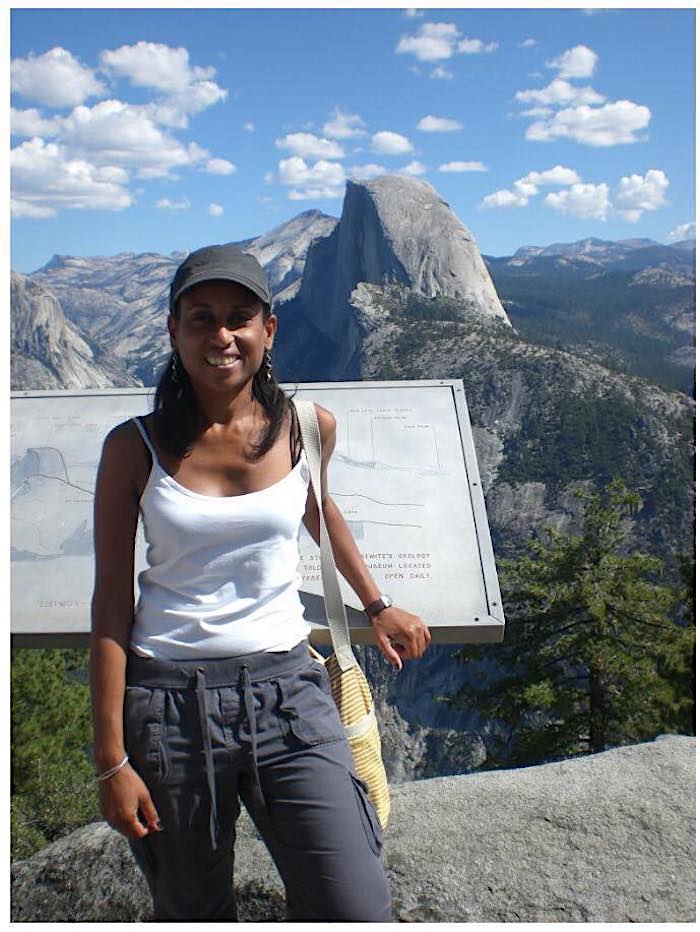 the author standing in front of Half Dome in Yosemite National Park