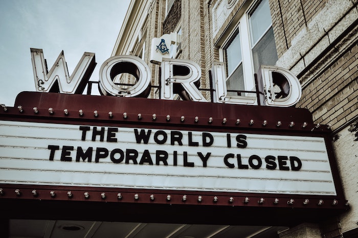 Marquee reading "The world is temporarily closed"