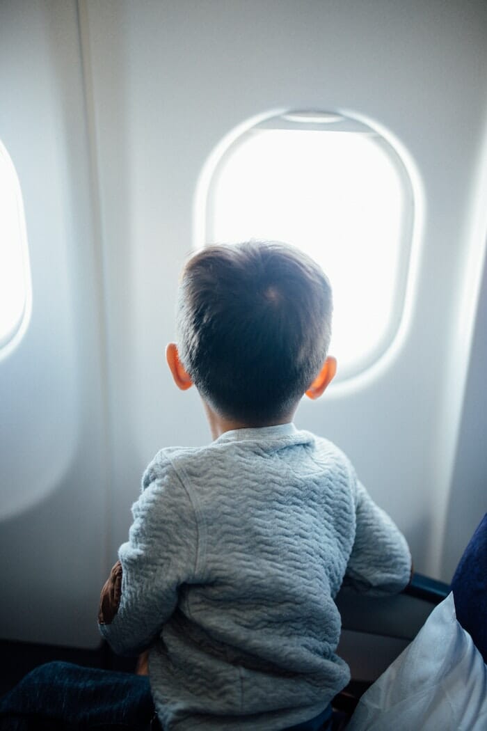 child looking out window