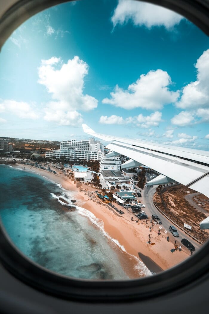 view of beach front outside airplane window