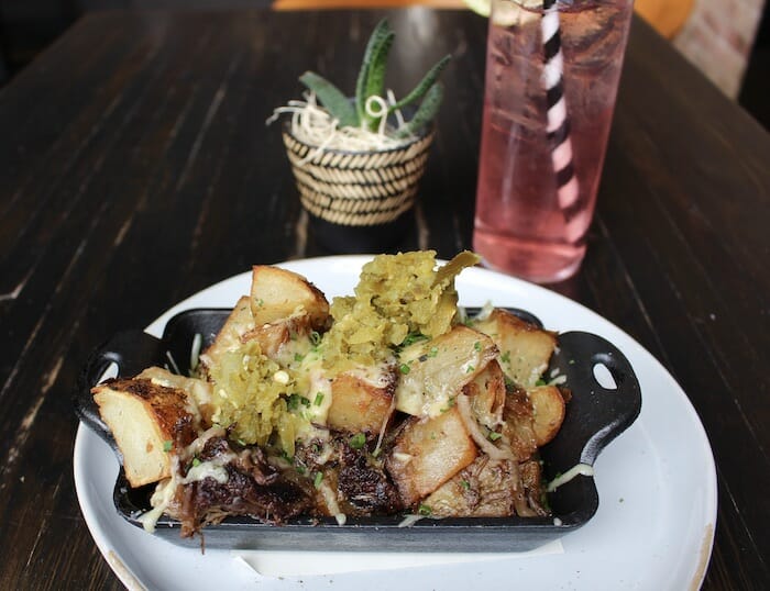 short rib hash with roasted potatoes, caramelized onions, cheddar cheese and jalapeno relish